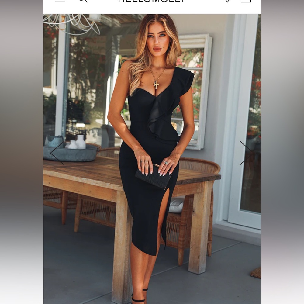One shoulder ruffle midi dress with side slit.  Never worn.